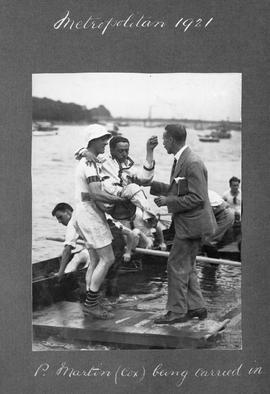 Metropolitan 1921 - P Martin (cox) being carried in